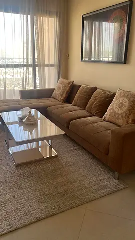 Comfortable 4-Seater Brown Fabric Sofa with Chaise (including table)