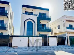 Two-story villa with a roof terrace, price inclusive of registration fees, in one of Ajman's mos