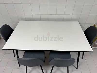 Dining table with four grey chairs - modern set