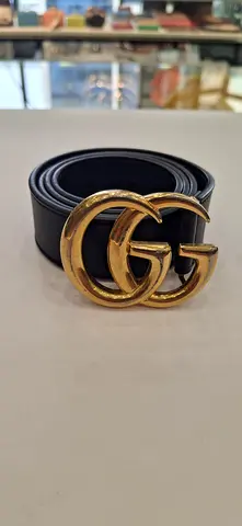 Black leather belt with gold double G-style buckle