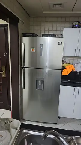 Stainless Steel Side-by-Side Refrigerator with Water Dispenser - Good Condition