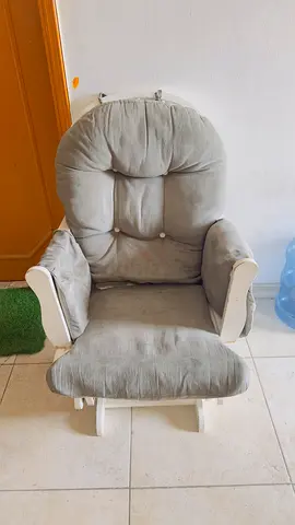 Comfortable grey padded rocking/glider chair — used