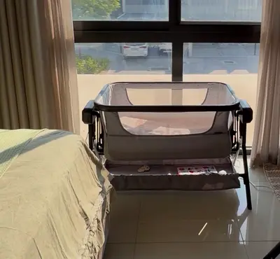 Portable bassinet/playpen with changing shelf - grey