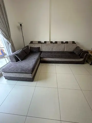 L-shaped Grey Fabric Sofa with Chaise - Good Condition (for free)