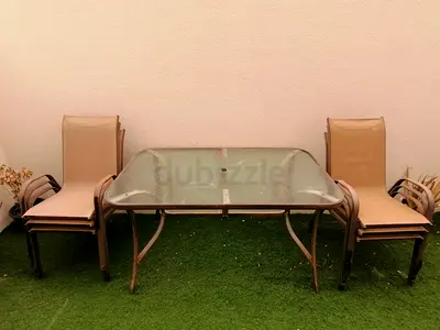 Outdoor glass table and 6 chairs