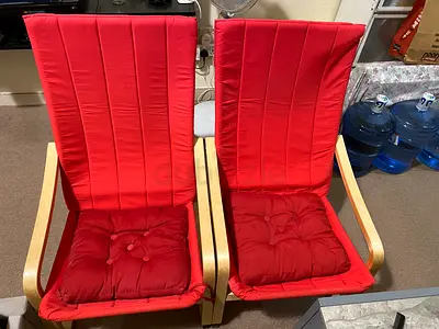 Pair of red cushioned wooden armchairs in good used condition only little cover dirty and and