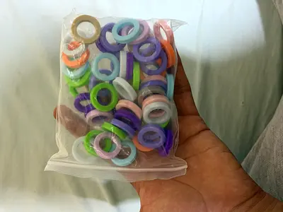 Pack of colorful plastic grommets/rings - new