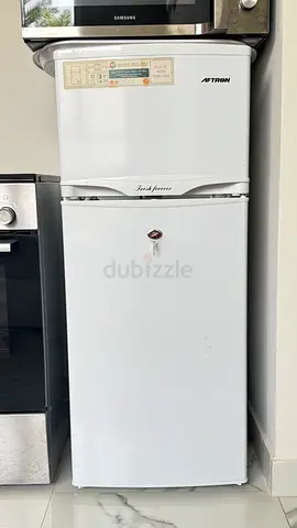 Compact two-door refrigerator (small fridge) - good working condition