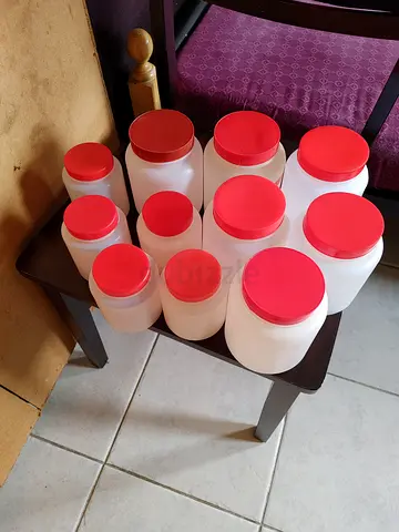 Set of 9 Plastic Storage Jars with Red Lids - Used