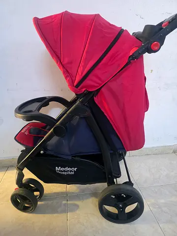 Red single stroller in good used condition