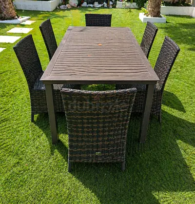 Outdoor 6-Seater Rattan Dining Table Set is in excellent condition.