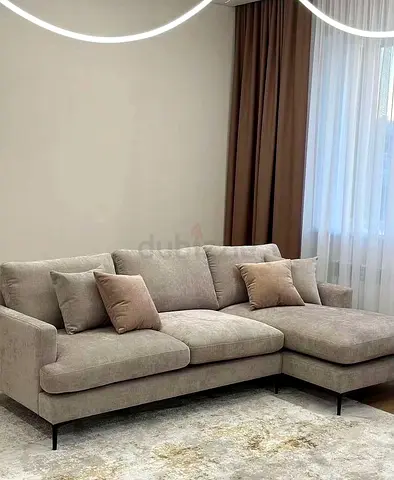Light taupe L-shaped fabric sofa with chaise - modern, good condition