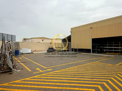 For sale: fenced land with an area of 10,000 sq ft Industrial Al-Sajaa S It has an income of 170,000 AED, includes office and warehouse buildings,