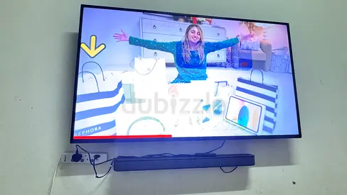 65 inch Wall-Mounted LED TV with Soundbar - Good Working Condition