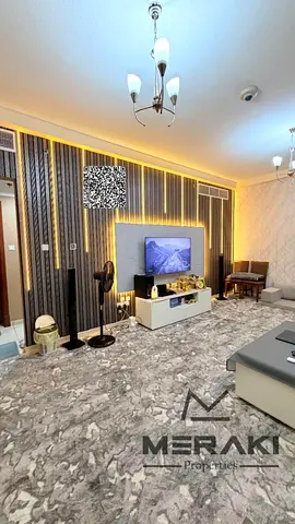 Two-bedroom apartment with a living room at a very good price, super luxury finishing, in a strategic location near Ajman Port, with a beautiful area