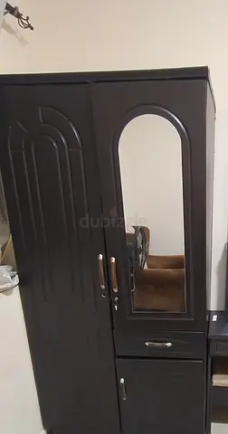 Dark wooden wardrobe/armoire with mirror and drawers - good condition