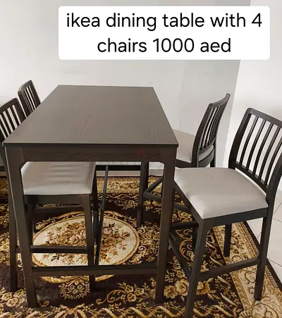 IKEA dining table with 4 chairs - dark wood, good condition