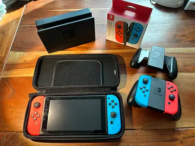 Nintendo Switch console with Neon Joy-Cons, case and accessories