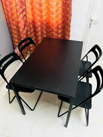 Black dining table with 4 matching chairs - compact set