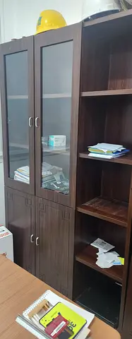 Dark wood office bookcase with glass doors and cabinets — good condition