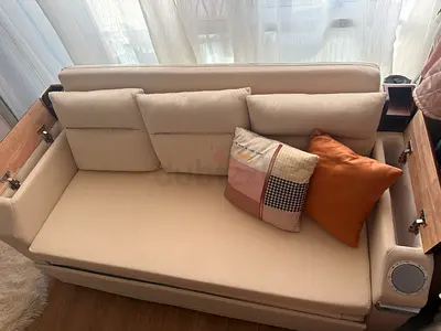 Compact Beige Fabric Sofa Bed with Built-in Side Tables