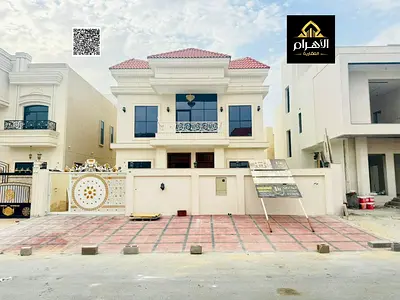 Villa for sale in Al Helio, 2 floors and a roof, very prime location next to services, within a residential compound and close to Mohammed Bin Zayed R