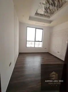 Two-bedroom master bedroom apartment with living room in Al Jurf 1, three bathrooms, built-in wardro