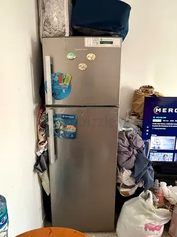 Used double-door refrigerator with top freezer — good working condition