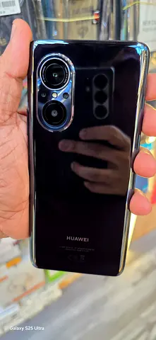 Huawei phone in good working condition - sleek black back