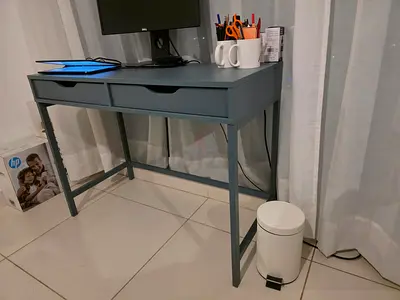 Small two-drawer study desk in blue-grey and chair