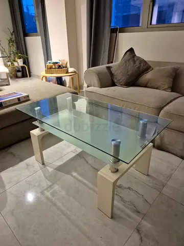 Glass coffee table with double glass. Good conditions. White legs are a bit woobly.