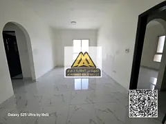 A spacious two-bedroom apartment with a living room is available for annual rent in Al Rashidiya, Mi