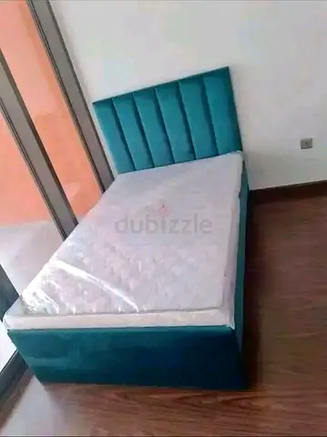 Single upholstered bed with mattress — teal, like new