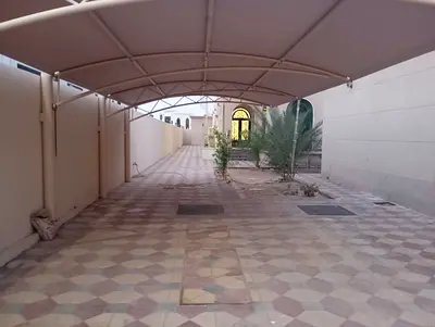 A premium family villa in Hoshi, Sharjah, offering spacious living, a private garden, and full faci