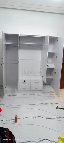 We are selling 4 door wood wardrobe brand new available