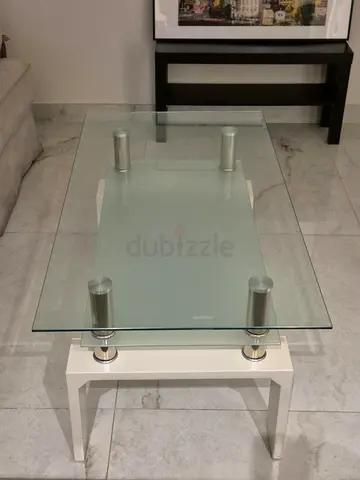 Glass coffee table with double glass. Good conditions. White legs are a bit woobly.