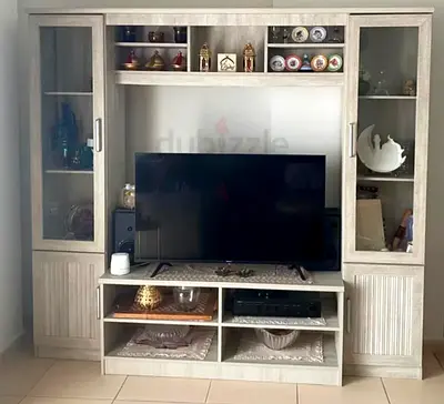 Light wood entertainment center with glass display cabinets - good condition