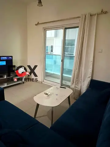 Furnished 1-bedroom apartment for annual rent, open-view balcony, nice view, free parking, prime location close to all services.