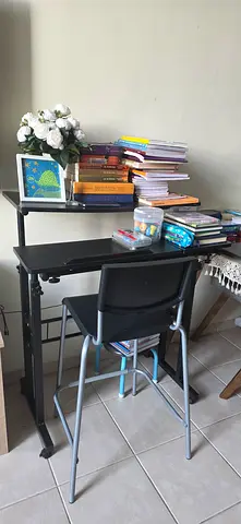 Compact black study desk with chair and shelving - good condition