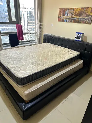 King size bed frame plus one king size mattress. In good condition.