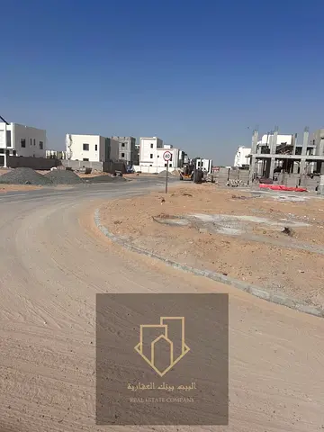 Corner plot of land on two streets and an alley in Al Yasmin, best exclusive price including registration fees
