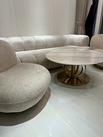 Home centre Beige Sofa 3+2 Seater with Round centre table for your living.