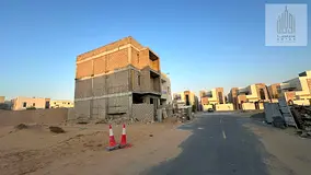 Residential land for sale on a corner lot, 2045 sq ft, in Al Zahia Square. Double fee exemption. Res
