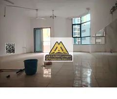 2BR + maid in Al Khor Towers, Ajman. 3 baths, 2 balconies, open view. AED 40,000 yearly, 4 payments.