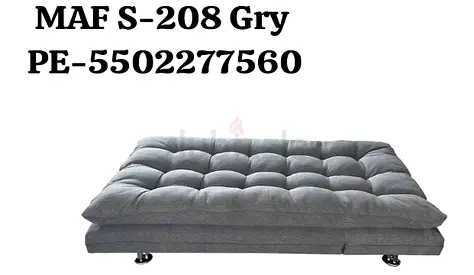 Grey fold-out futon sofa bed — compact convertible seating/bed