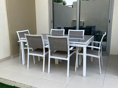 Glass top table and 6 chairs with a custom outdoor dust cover