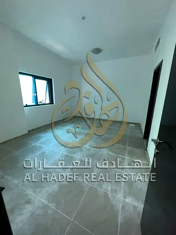 For rent in Al Mamzar Al Taawun area: Spacious one-bedroom apartment with a living room. Directly on the Dubai exit. Amenities include a men's
