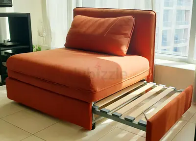 Compact IKEA Single Sofa Bed with Pull-Out Trundle