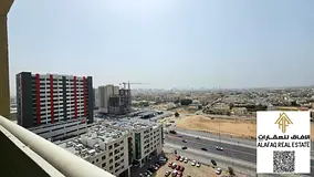 Studio for annual rent in Garden City with open balcony and private parking inside the tower at a sp
