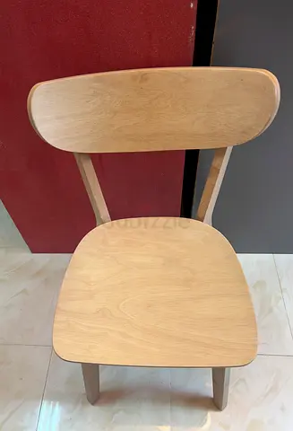 Light wooden dining chair — simple modern design